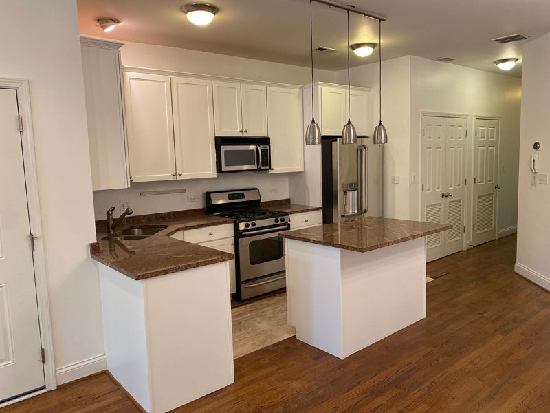 White kitchen cabinets and island