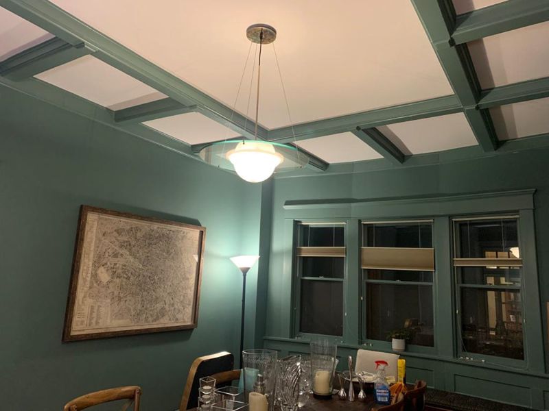 Dining room with green coffered ceiling and trim