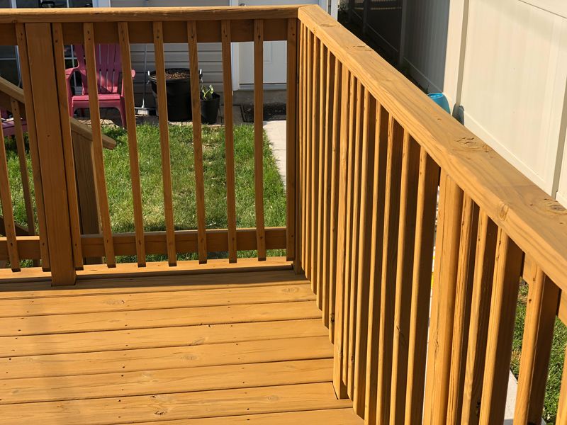 Freshly stained wood deck and railing